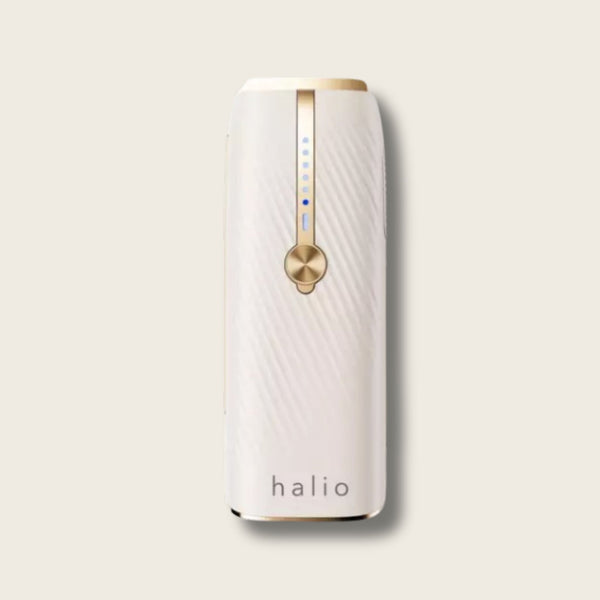 White Halio InfinityGlow IPL hair removal device with gold control dial, blue indicator lights, and Sapphire Cooling design.
