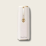 White Halio InfinityGlow IPL hair removal device with gold control dial, blue indicator lights, and Sapphire Cooling design.