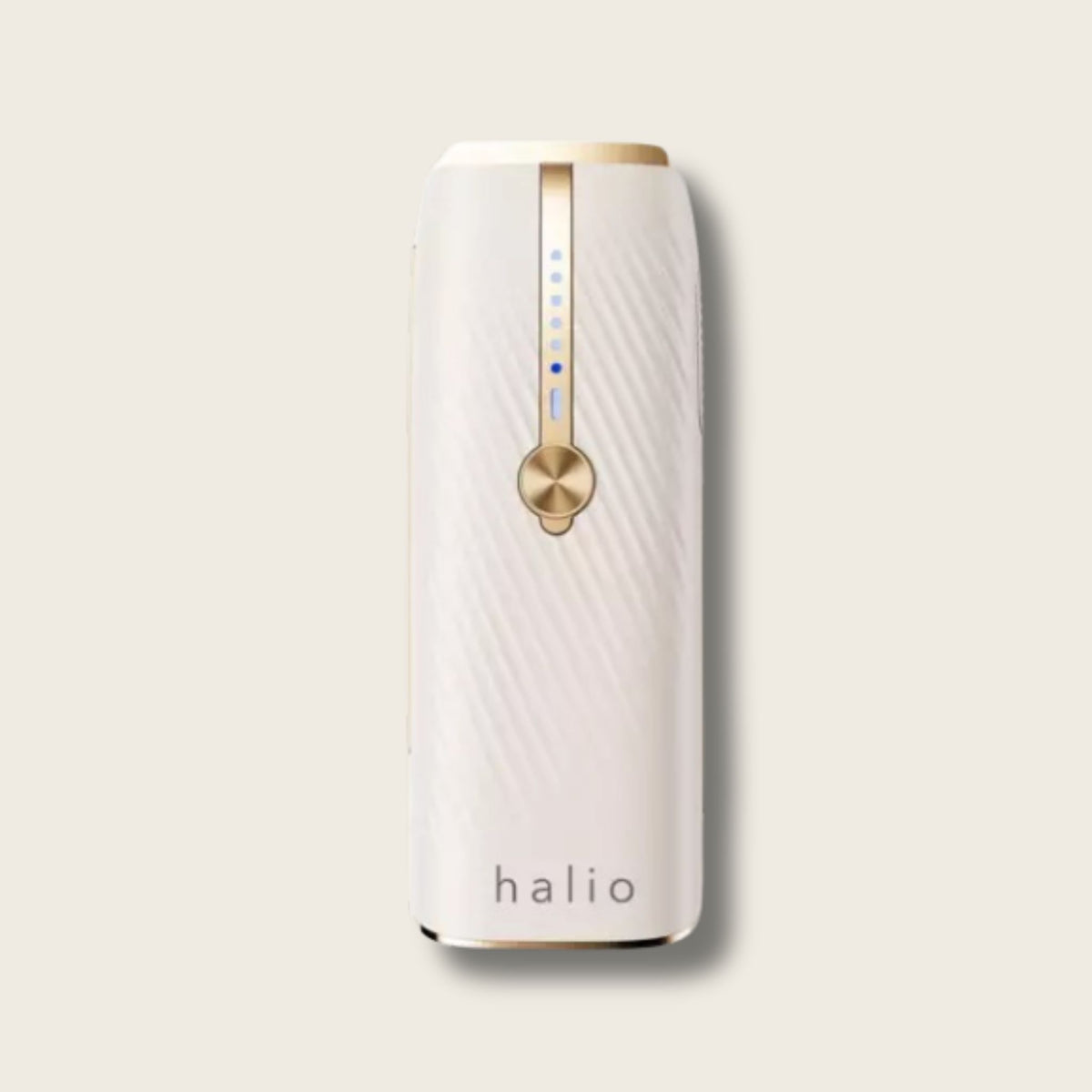 White Halio InfinityGlow IPL hair removal device with gold control dial, blue indicator lights, and Sapphire Cooling design.