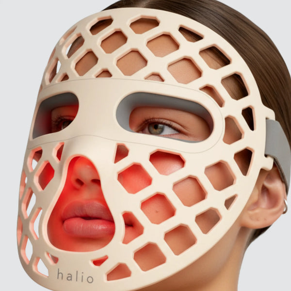 Person wearing a beige honeycomb face mask with 'halio' branding.