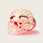 Halio PureGlow Ultralite silicone LED face mask with honeycomb cutouts, eye openings, and red light visible through the design