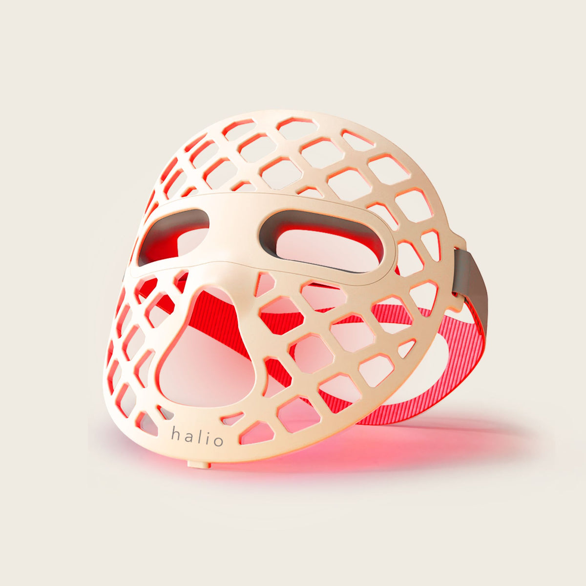 Halio PureGlow Ultralite silicone LED face mask with honeycomb cutouts, eye openings, and red light visible through the design