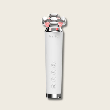 Halio RevitaWave 4-in-1 facial skincare wand with metallic treatment head and EMS, RF, VR, and LED controls.