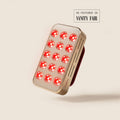 Halio RegenBoost handheld red light therapy panel with glowing LEDs; “AS FEATURED IN VANITY FAIR” text visible.