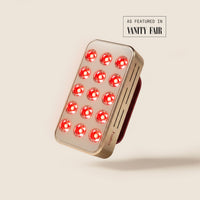 Halio RegenBoost handheld red light therapy panel with glowing LEDs; “AS FEATURED IN VANITY FAIR” text visible.