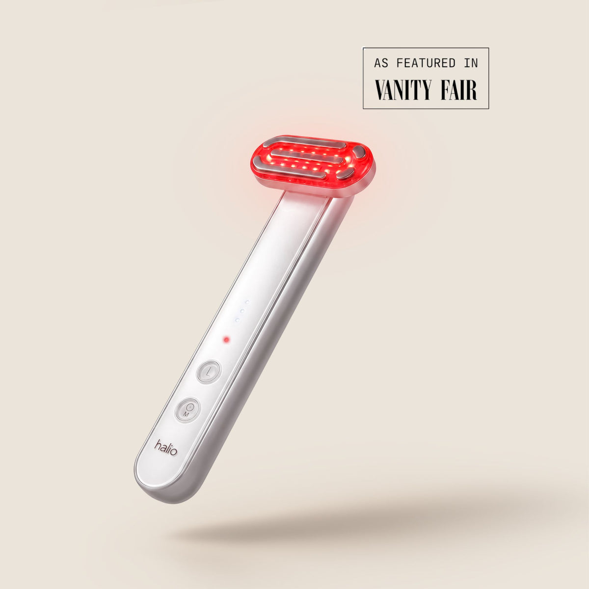 Halio red light therapy wand with illuminated red LED head; “AS FEATURED IN VANITY FAIR” badge visible.
