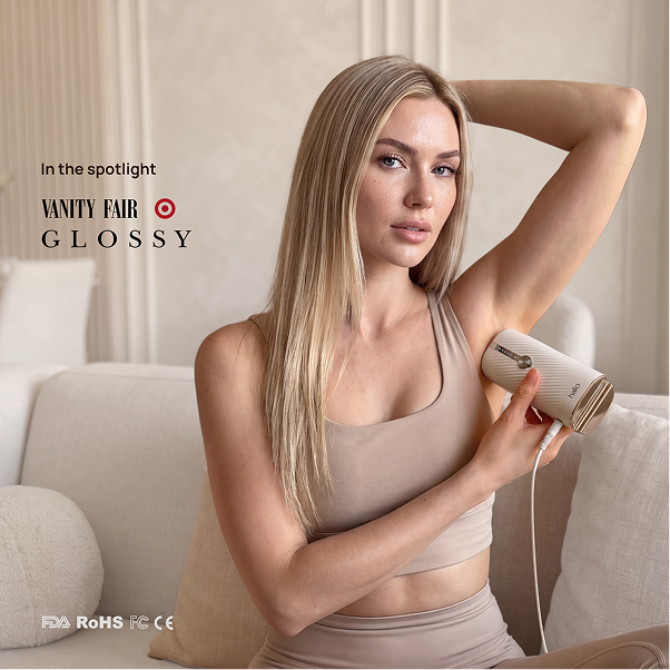 Woman using a Halio InfinityGlow IPL hair removal device, with “VANITY FAIR GLOSSY” and product branding visible.
